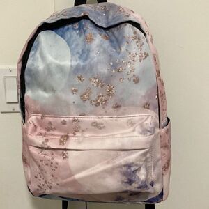 Yin Lang Nylon Backpack by Soundbyte in Pink & blue pattern.